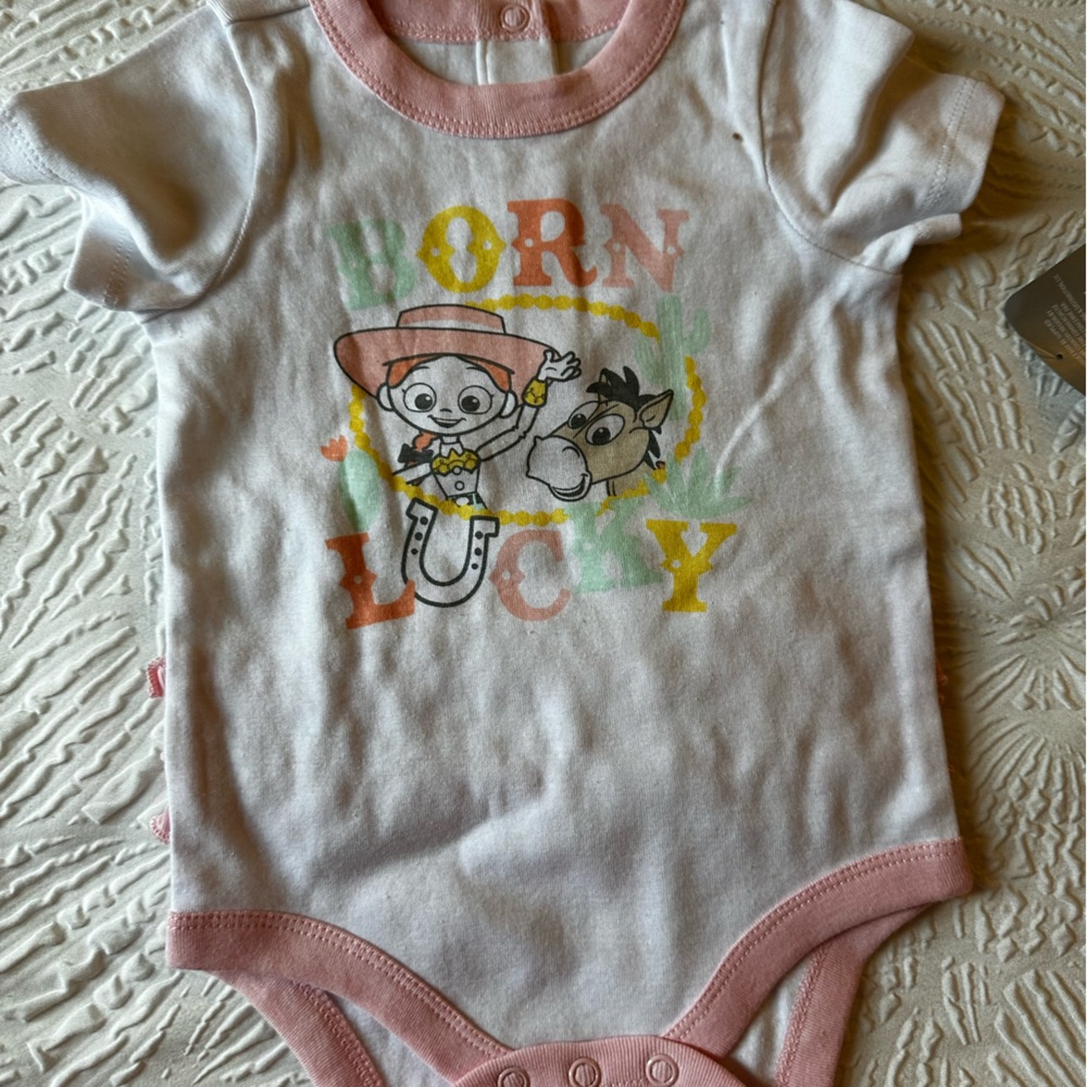 New Disney Baby Onesie . Jessie & Bullseye “Born Lucky”NWT